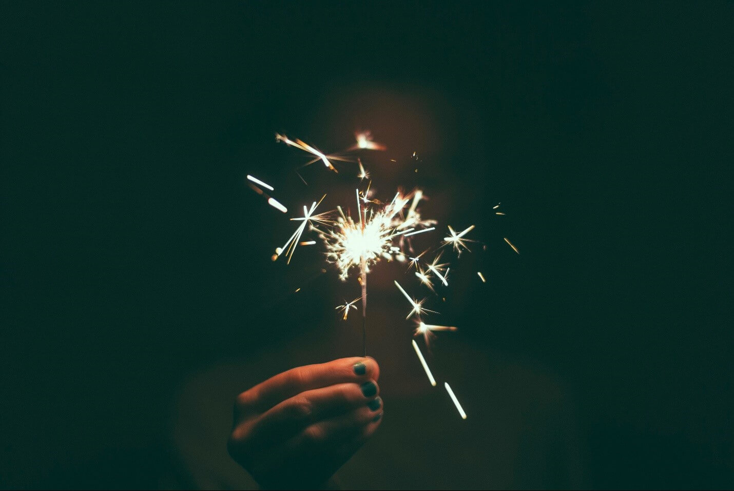 Young Woman Holding Fireworks