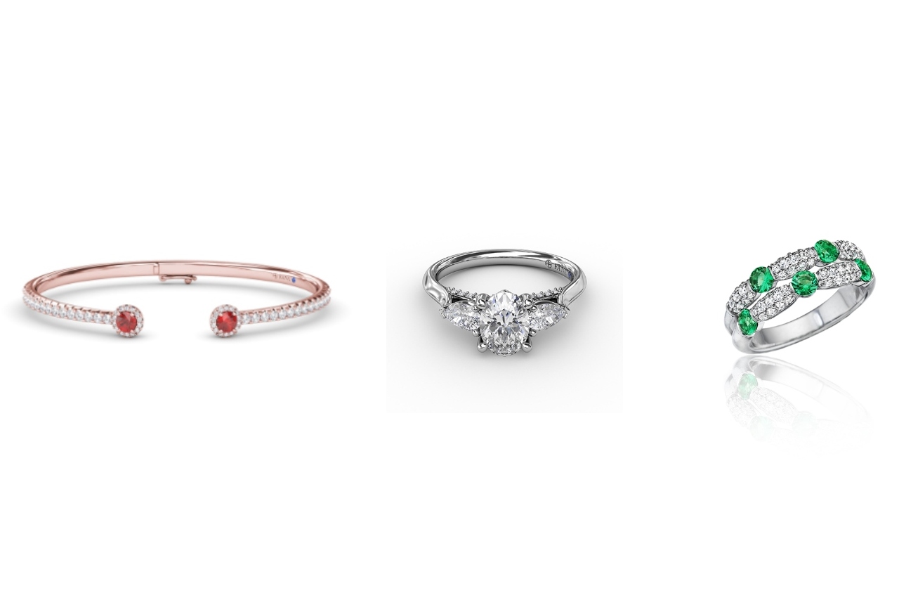 Three pieces of Fana jewelry: a rose gold with diamond and ruby bracelet, a three stone diamond ring, and a white gold with diamond and emerald ring
