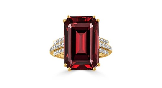 a yellow gold fashion ring featuring a large, emerald cut, red garnet and accent diamonds