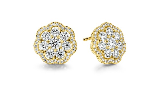 a pair of yellow gold diamond stud earrings by Hearts On Fire
