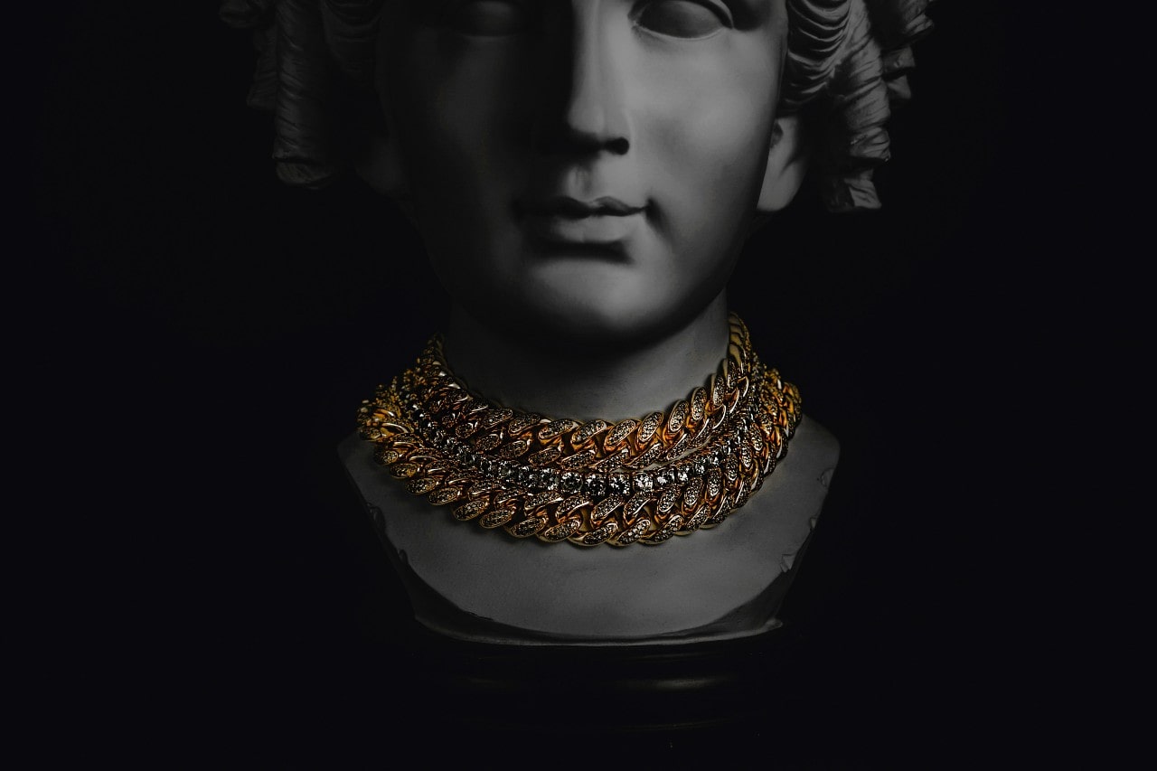 a lady’s bust with chain necklaces on it