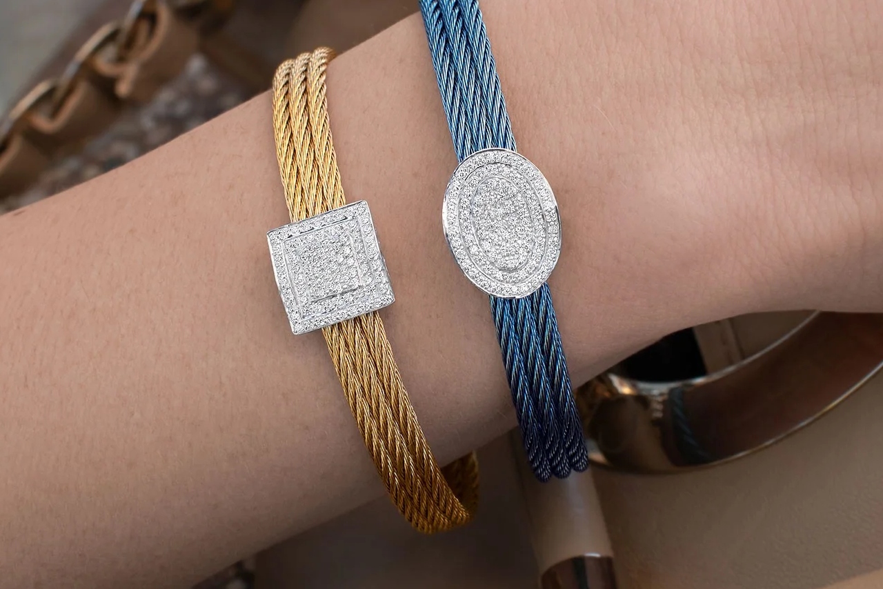 Yellow gold and signature blue twisted coil bracelets by ALOR with stunning oval and square station pieces covered in sparkling diamonds