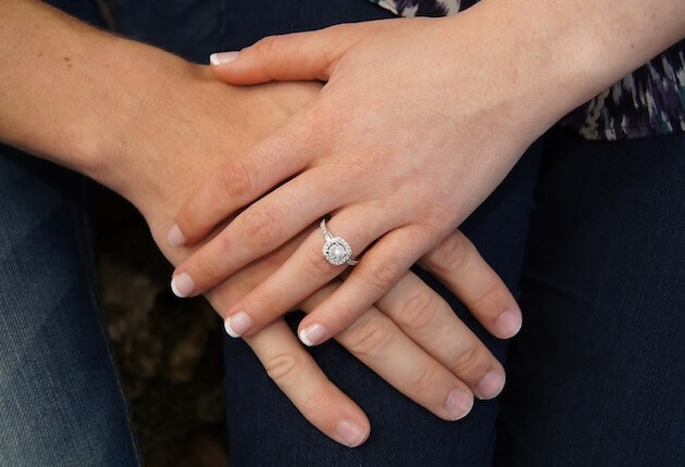 Two Hands with Engagement Ring