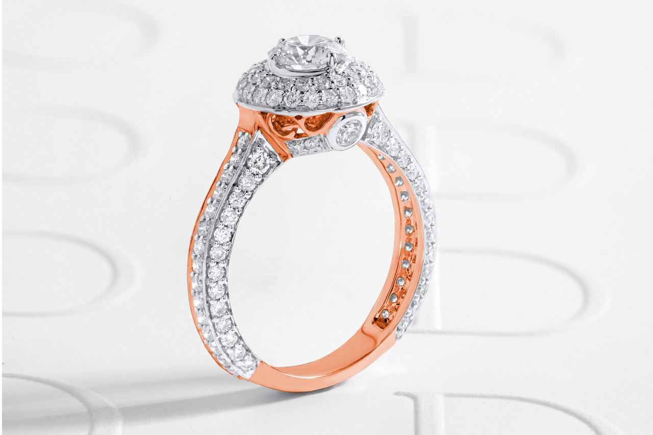 A stunning and ornate engagement ring adorned with many small diamonds. A stunning and ornate engagement ring adorned with many small diamonds.